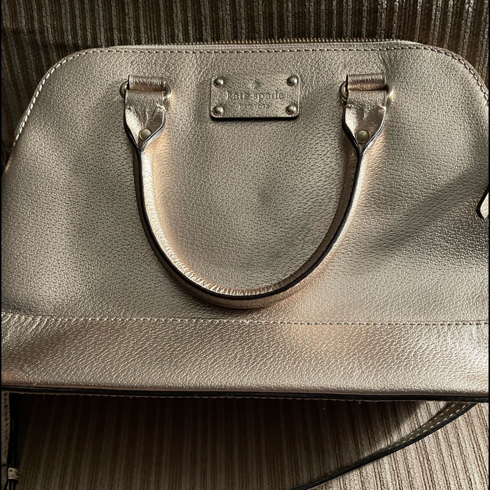 Rose gold Kate spade purse.